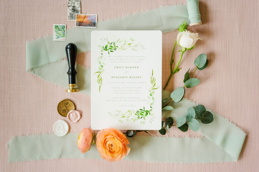 Wedding invitation and florals arranged for a Texas vineyard wedding at Dove Ridge Vineyard