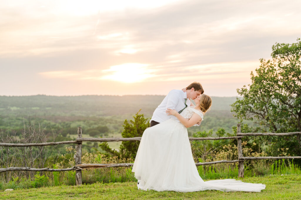 Emily and Ben share an epic sunset kiss at their Texas vineyard wedding 