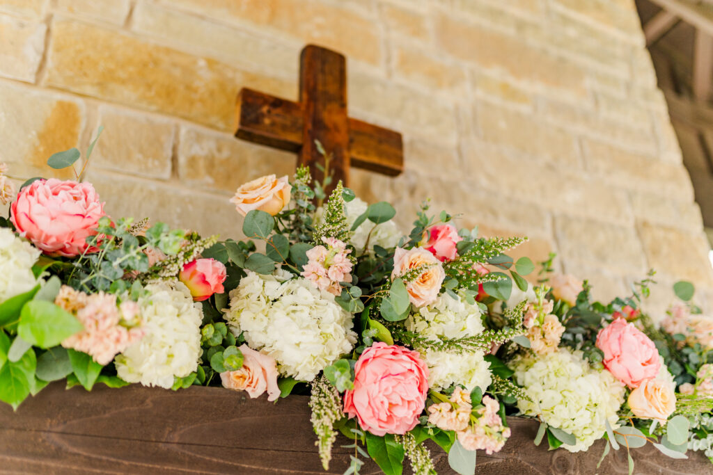 Wedding florals at the altar of at Texas vineyard wedding